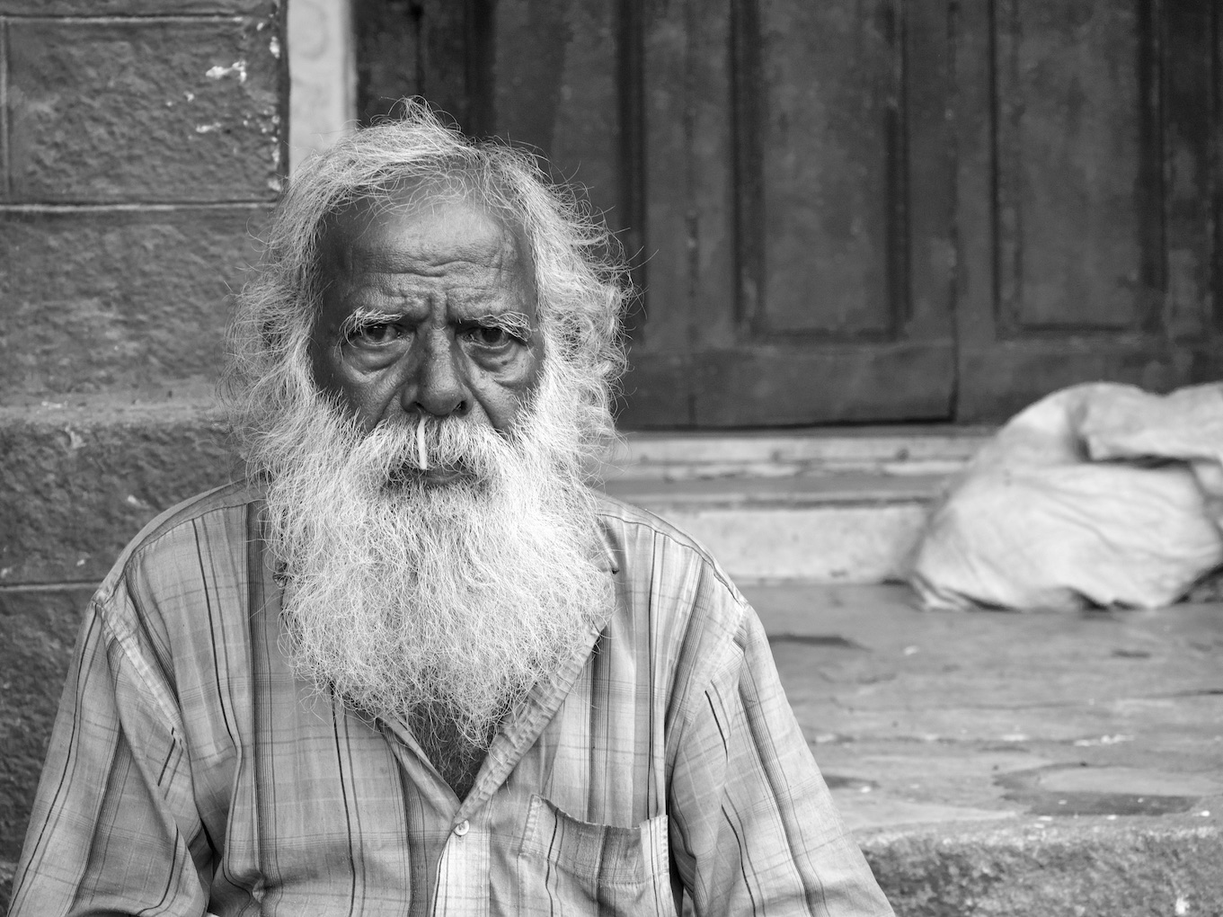 Old man with runny nose.