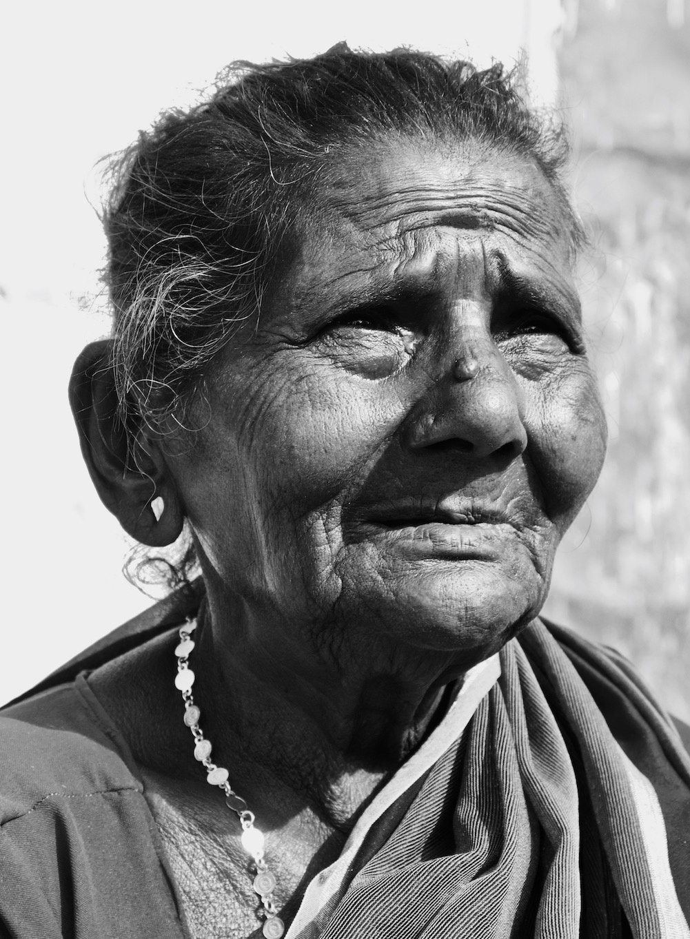 Old woman looking up.